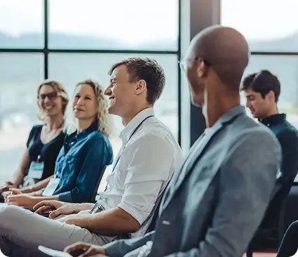 a group of people sitting in chairs